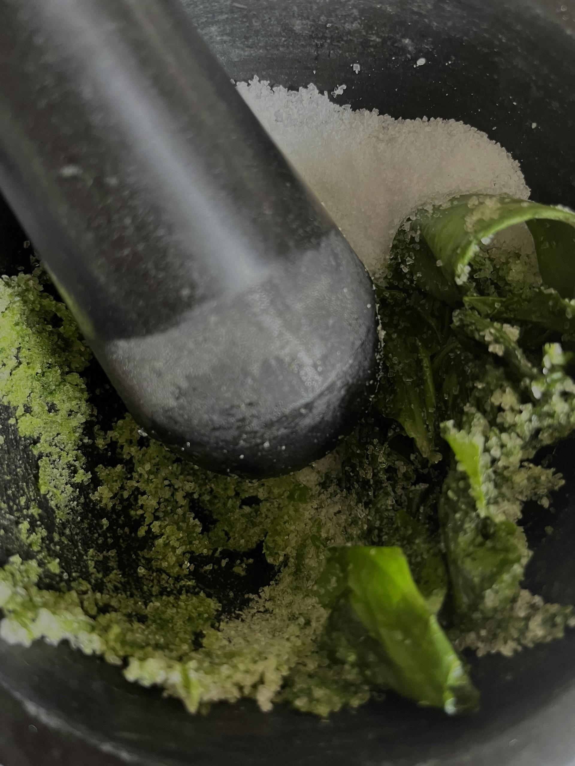 Ayurvedic herbs mortar pestle preparation — traditional medicine making